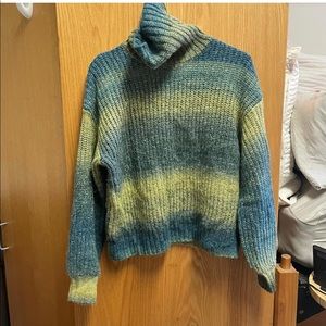 blue and green turtleneck with slight crop